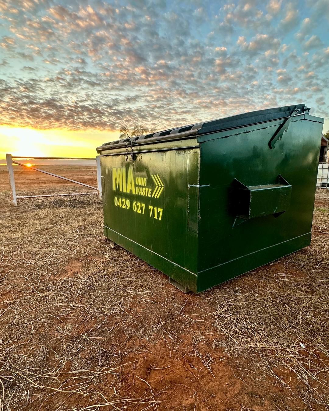 MIA Quik Waste bin at rural site at sunset – front lift waste bin hire Goolgowi NSW
