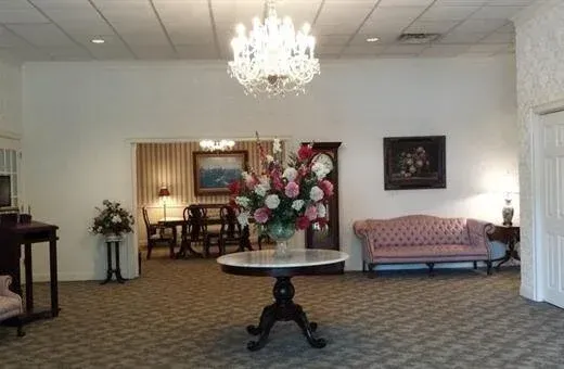 A church with rows of wooden benches and a podium