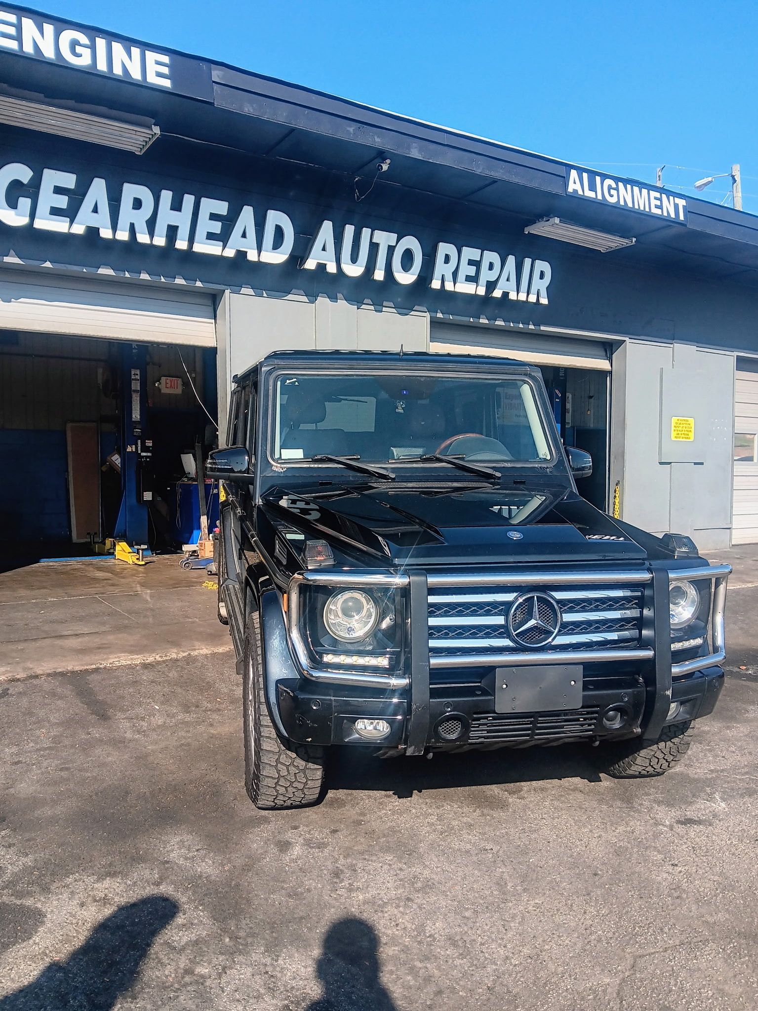 Black Mercedes-Benz G-Wagon parked in front of 