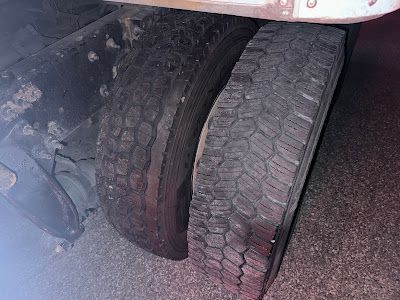 A close up of a tire on a truck.