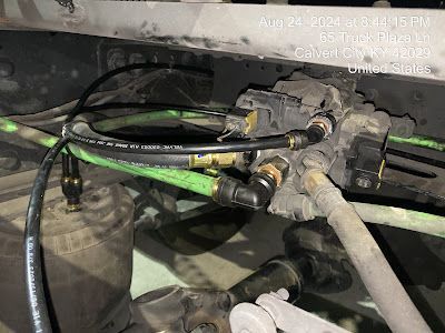 A close up of a brake system on a truck.