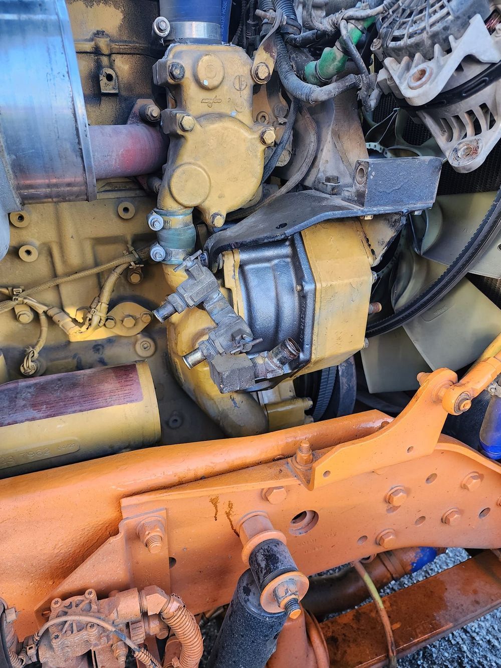 A close up of a rusty engine on a truck.