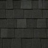 A close up of a black shingle roof.