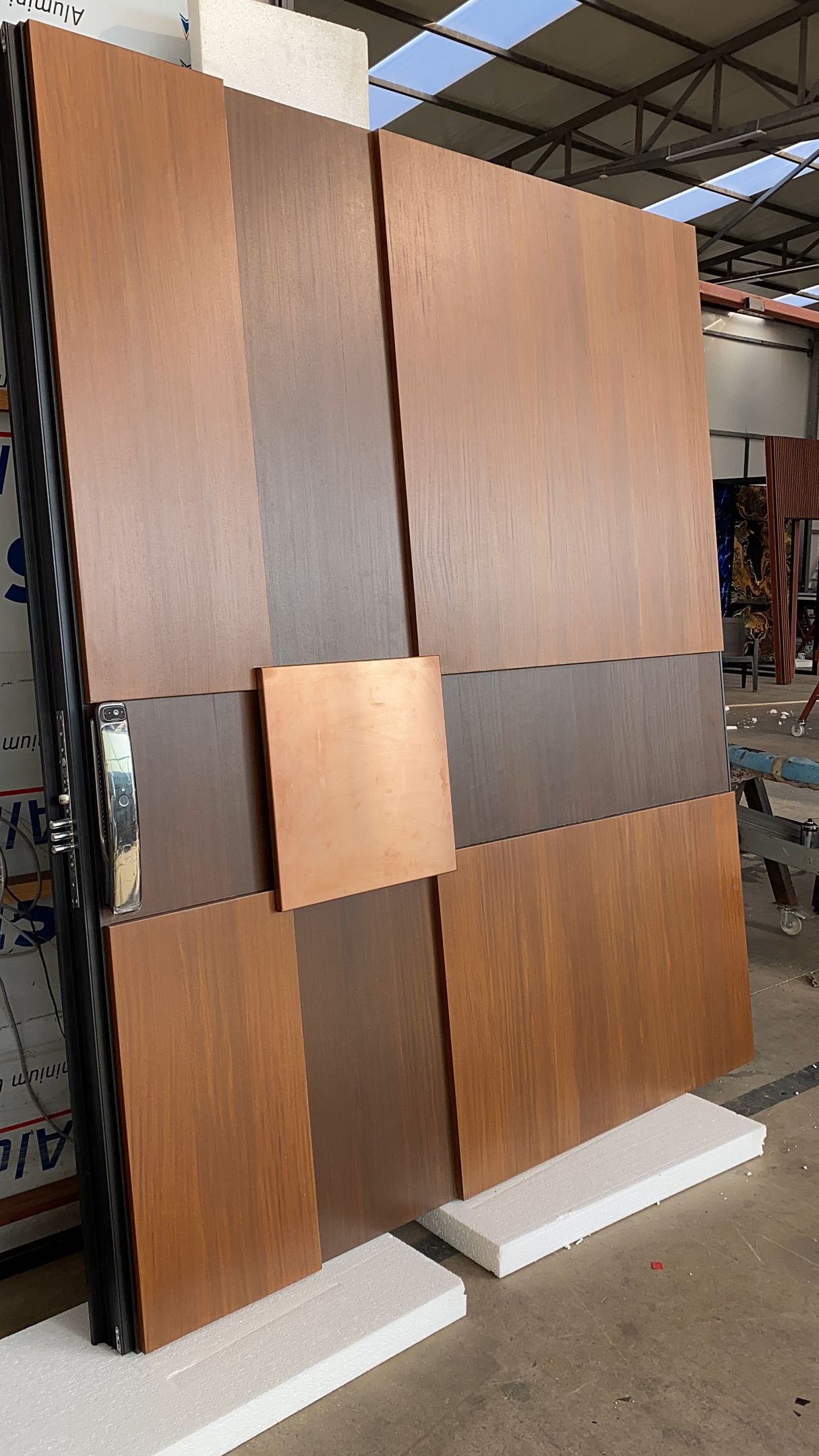 A large piece of wood is sitting on top of a table in a warehouse.
