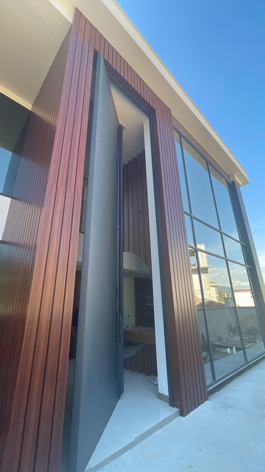 A large building with a lot of windows and a door.