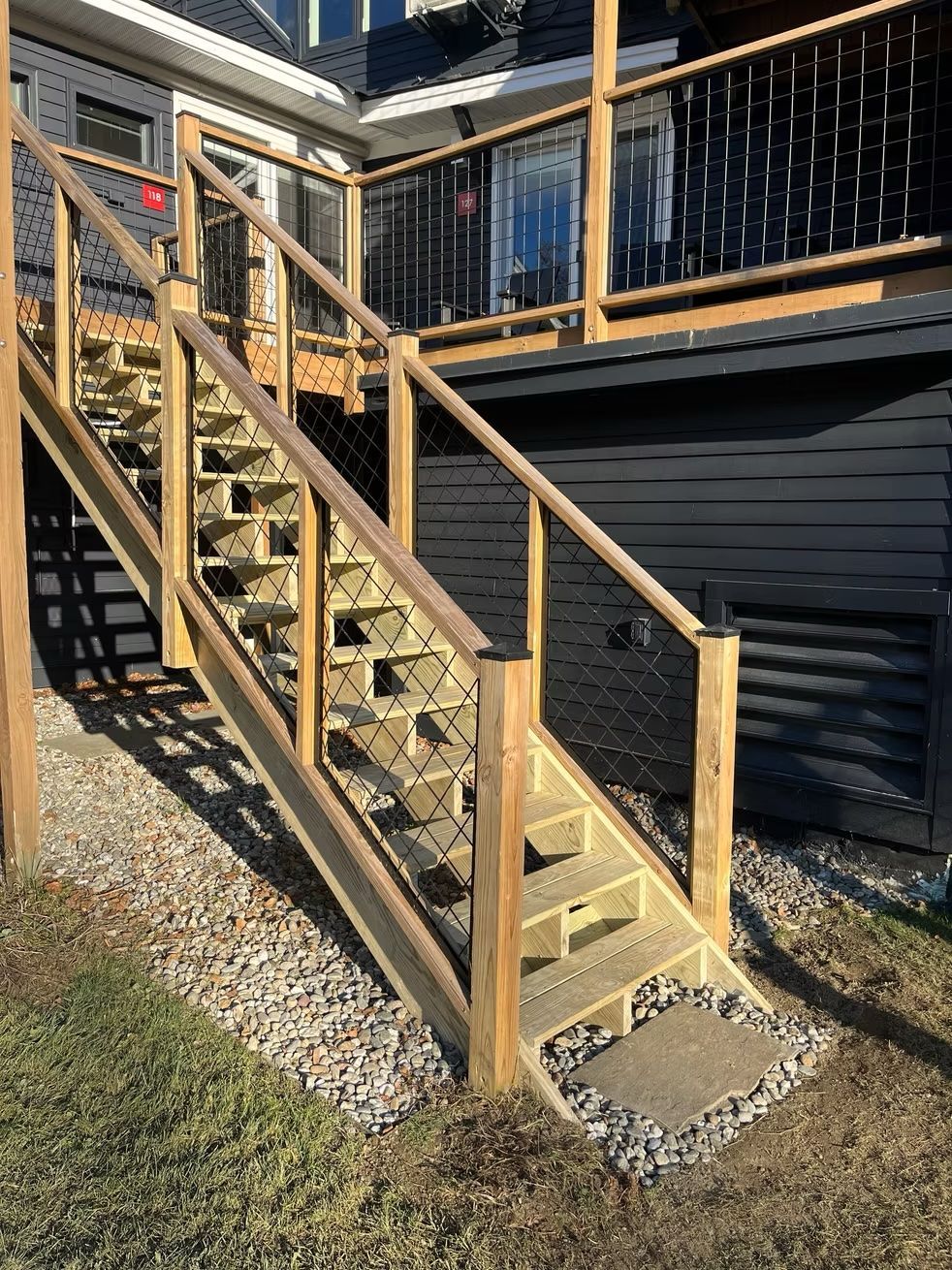 A wooden deck with stairs leading up to it.