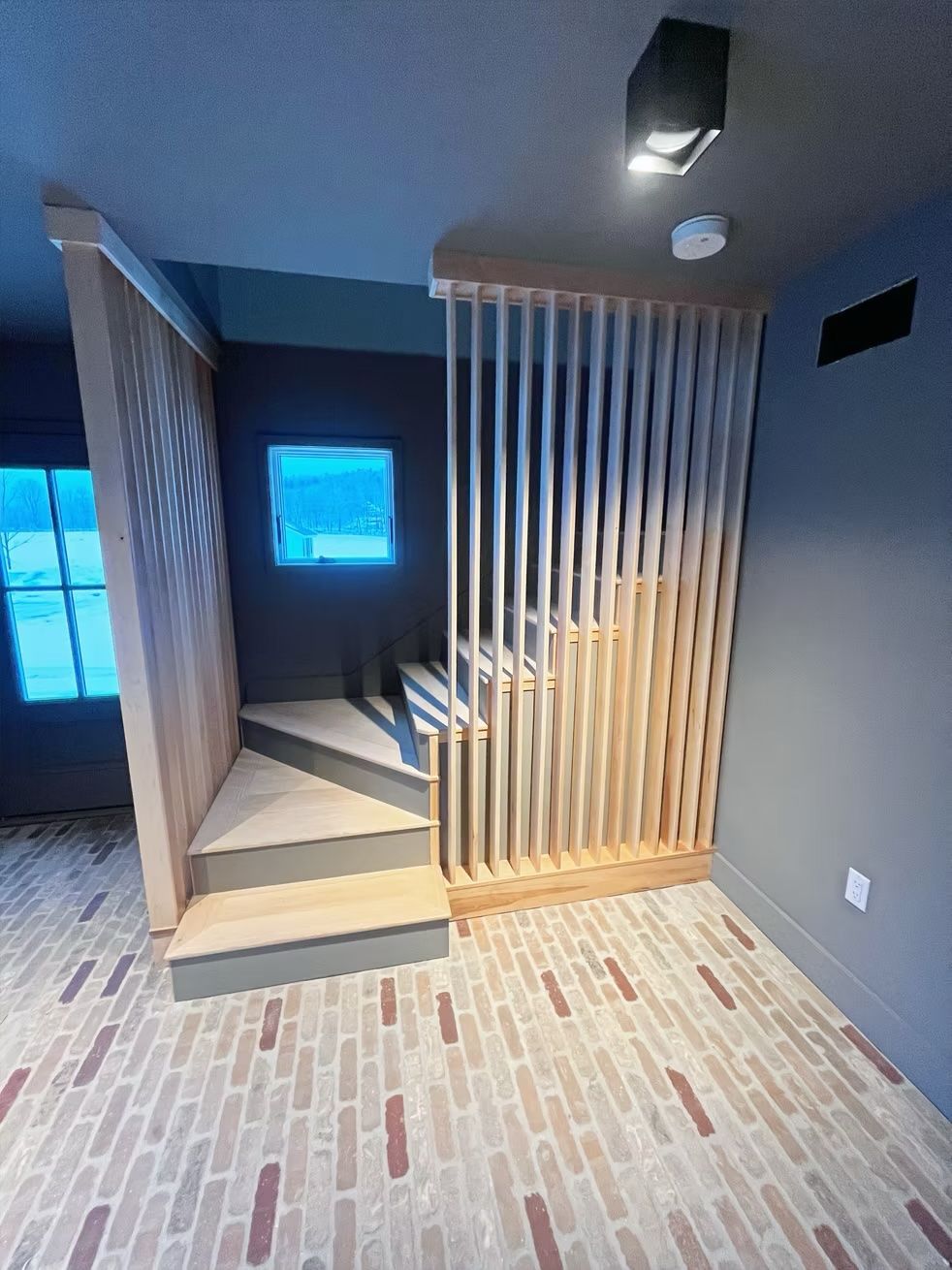 There is a staircase in the middle of the room.