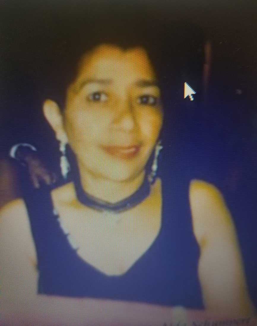 A close up of a woman 's face on a computer screen