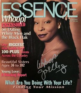 A signed copy of essence magazine with a woman on the cover
