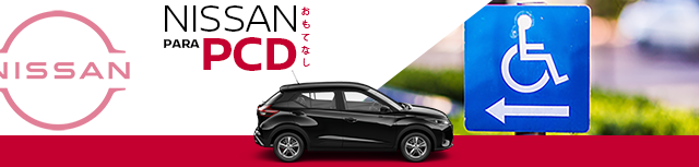 Uma folha branca de Nissan está estacionada em frente a um grande ímã vermelho.