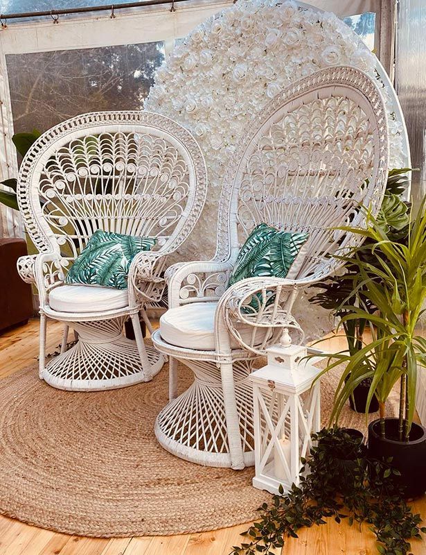 A Couple of White Wicker Chairs Sitting Next to Each Other on a Wooden Floor — Central Coast Events in Berkeley Vale, NSW