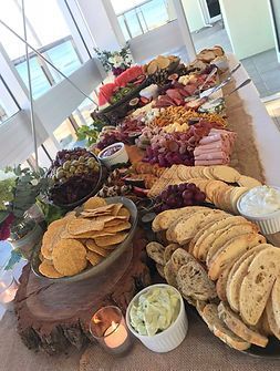 A Long Table Topped With Plates of Food and a Candle ― Central Coast Events in Berkeley Vale, NSW