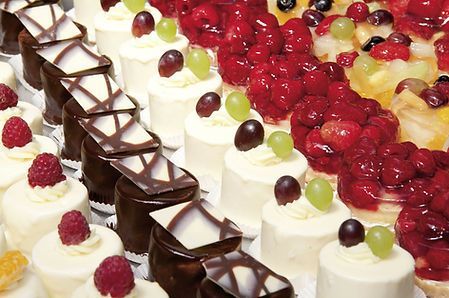 A Variety of Desserts With Berries on Top Are Lined Up on a Table ― Central Coast Events in Berkeley Vale, NSW