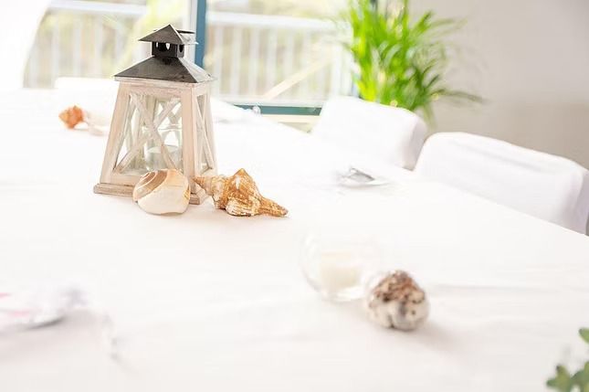 A Table With a Lantern and Seashells on It ― Central Coast Events in Berkeley Vale, NSW