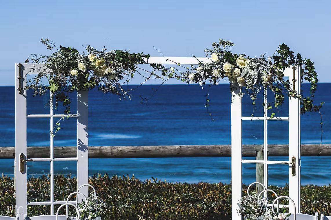 A Wedding Arch With Flowers and a View of the Ocean ― Central Coast Events in Berkeley Vale, NSW