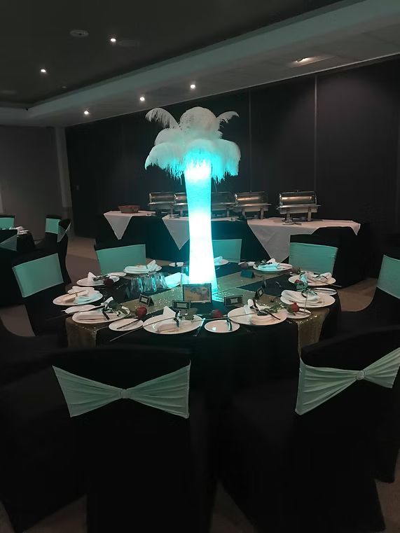 A Table Set for a Wedding Reception With a Feather Centerpiece ― Central Coast Events in Berkeley Vale, NSW