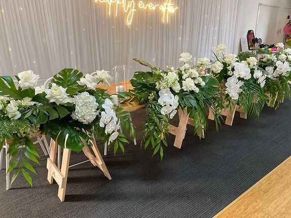 A Long Table With Flowers and a Neon Sign ― Central Coast Events in Berkeley Vale, NSW