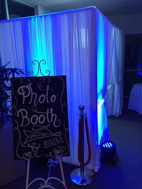 A Photo Booth With Blue Lights and a Sign in Front of It ― Central Coast Events in Berkeley Vale, NSW