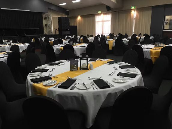 A Large Room With Tables and Chairs Set Up for a Wedding Reception ― Central Coast Events in Berkeley Vale, NSW