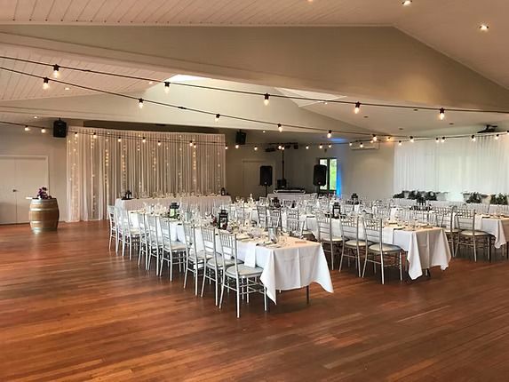 A Large Room With Tables and Chairs Set Up for a Wedding Reception ― Central Coast Events in Berkeley Vale, NSW