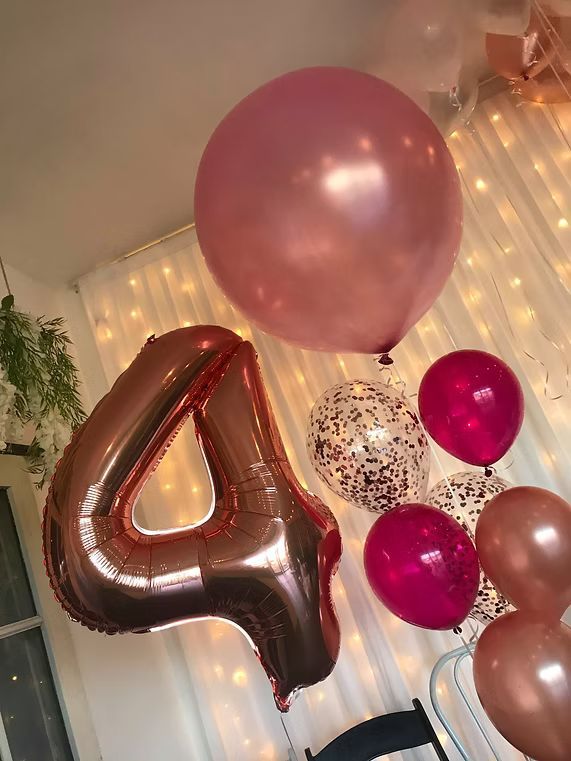 A Room Decorated With Balloons and a Large Number Four Balloon ― Central Coast Events in Berkeley Vale, NSW