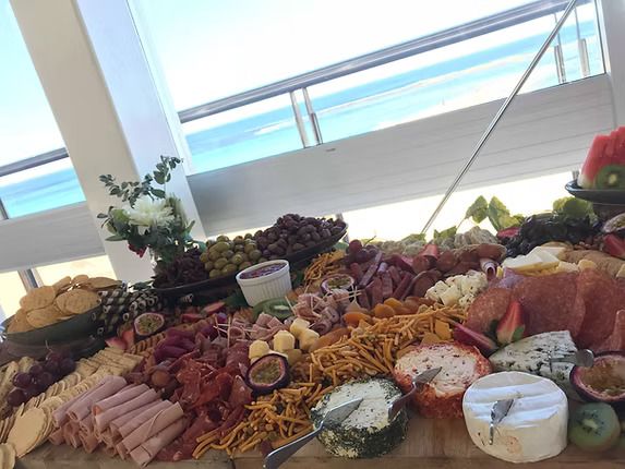 A Large Tray of Food is Sitting on a Table in Front of a Window ― Central Coast Events in Berkeley Vale, NSW
