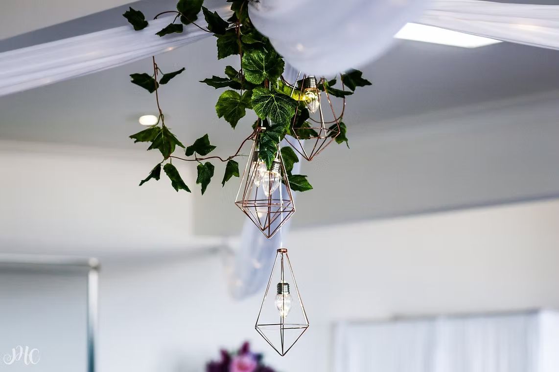 A Chandelier is Hanging From the Ceiling in a Room ― Central Coast Events in Berkeley Vale, NSW