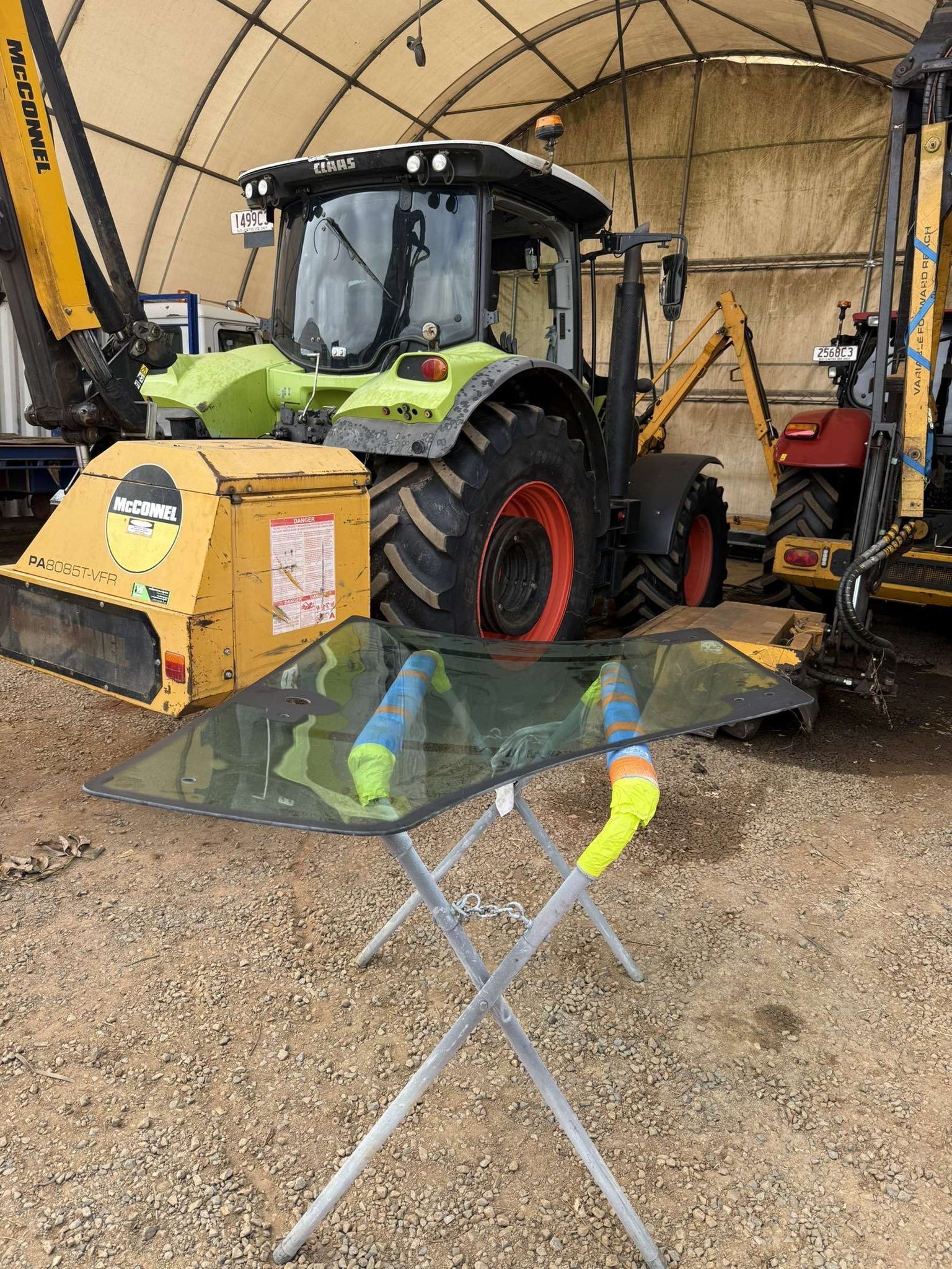 Close-up of a Yellow and Black Construction Excavator Cab — Far North Windscreens in Mareeba, QLD