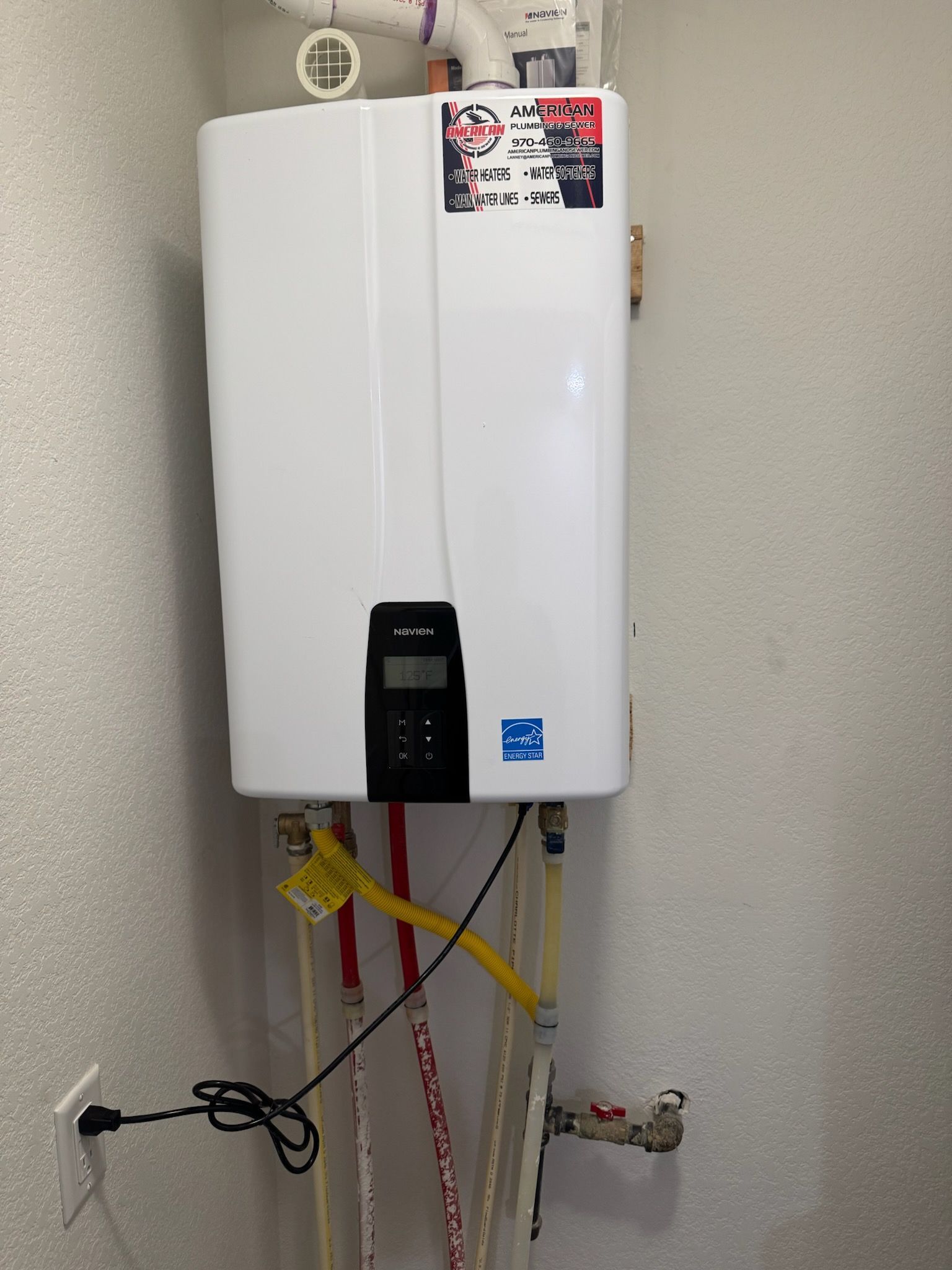 A person is adjusting a temperature knob to high