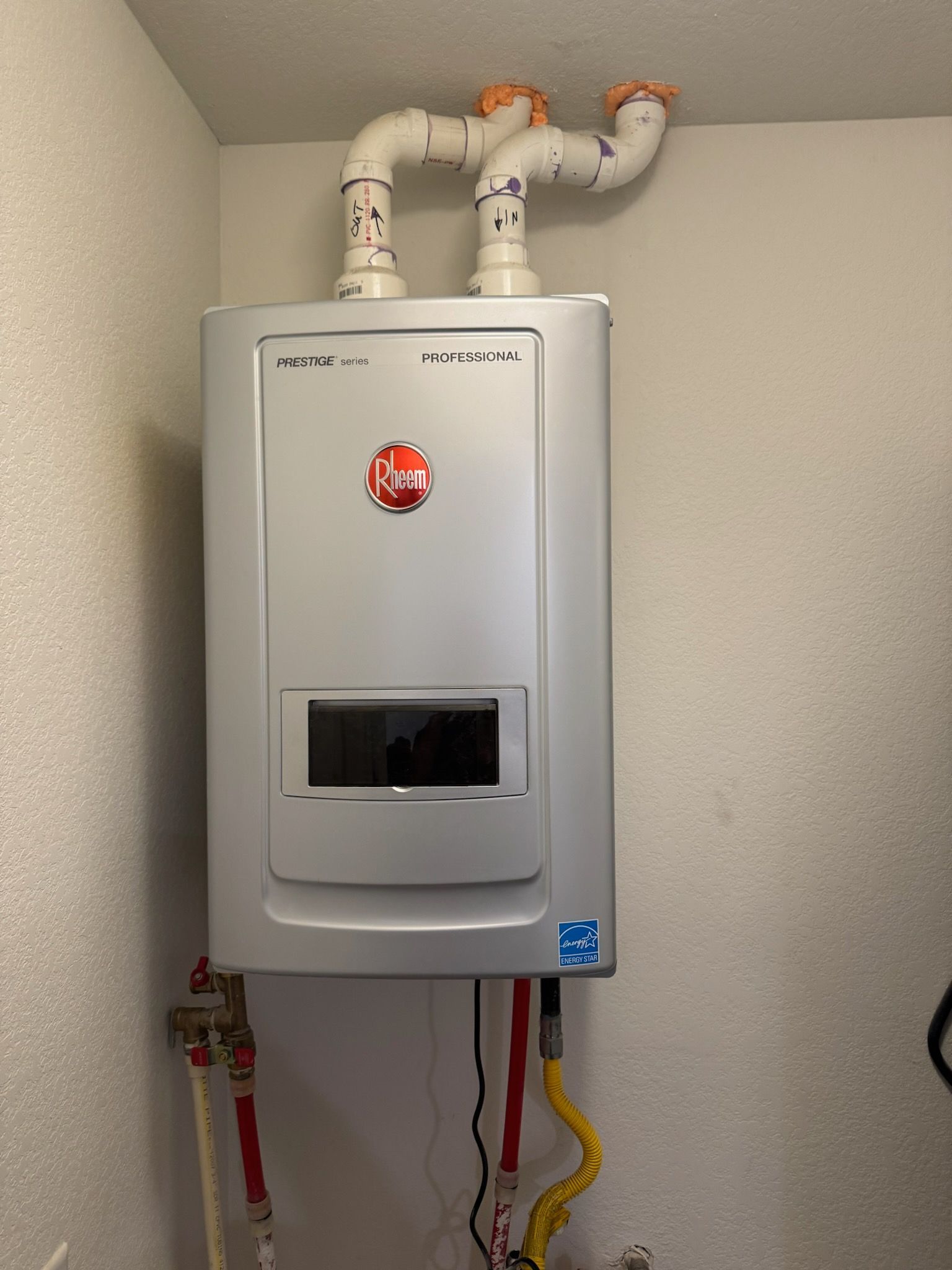 A person is adjusting a temperature knob to high