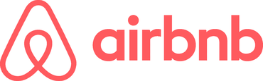 The airbnb logo is red and white on a white background.