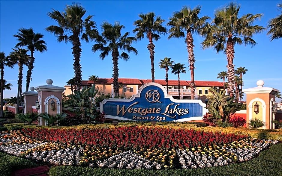 A large building with arches and a car parked in front of it.