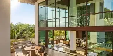 A large house with a lot of windows and furniture.