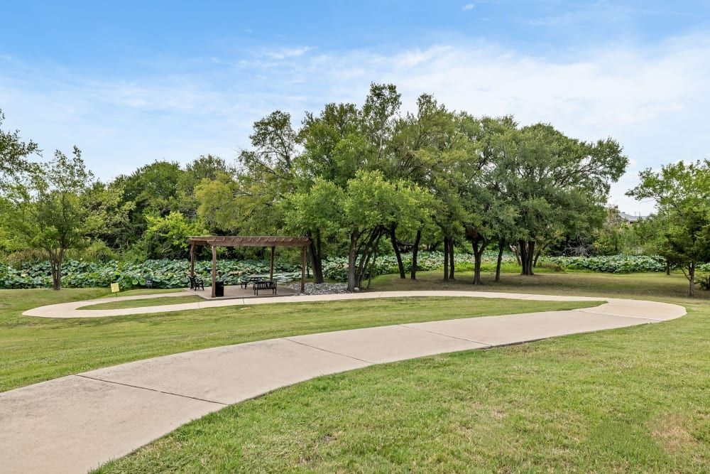 Senior living apartment comunity with walking trails at Marquis Rockwall in Rockwall, TX.