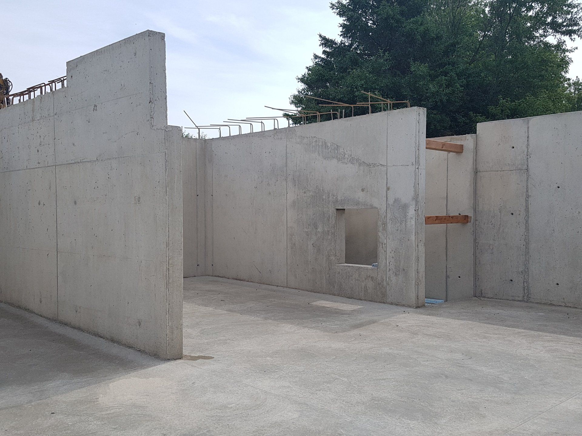 A concrete wall with a hole in the middle of it