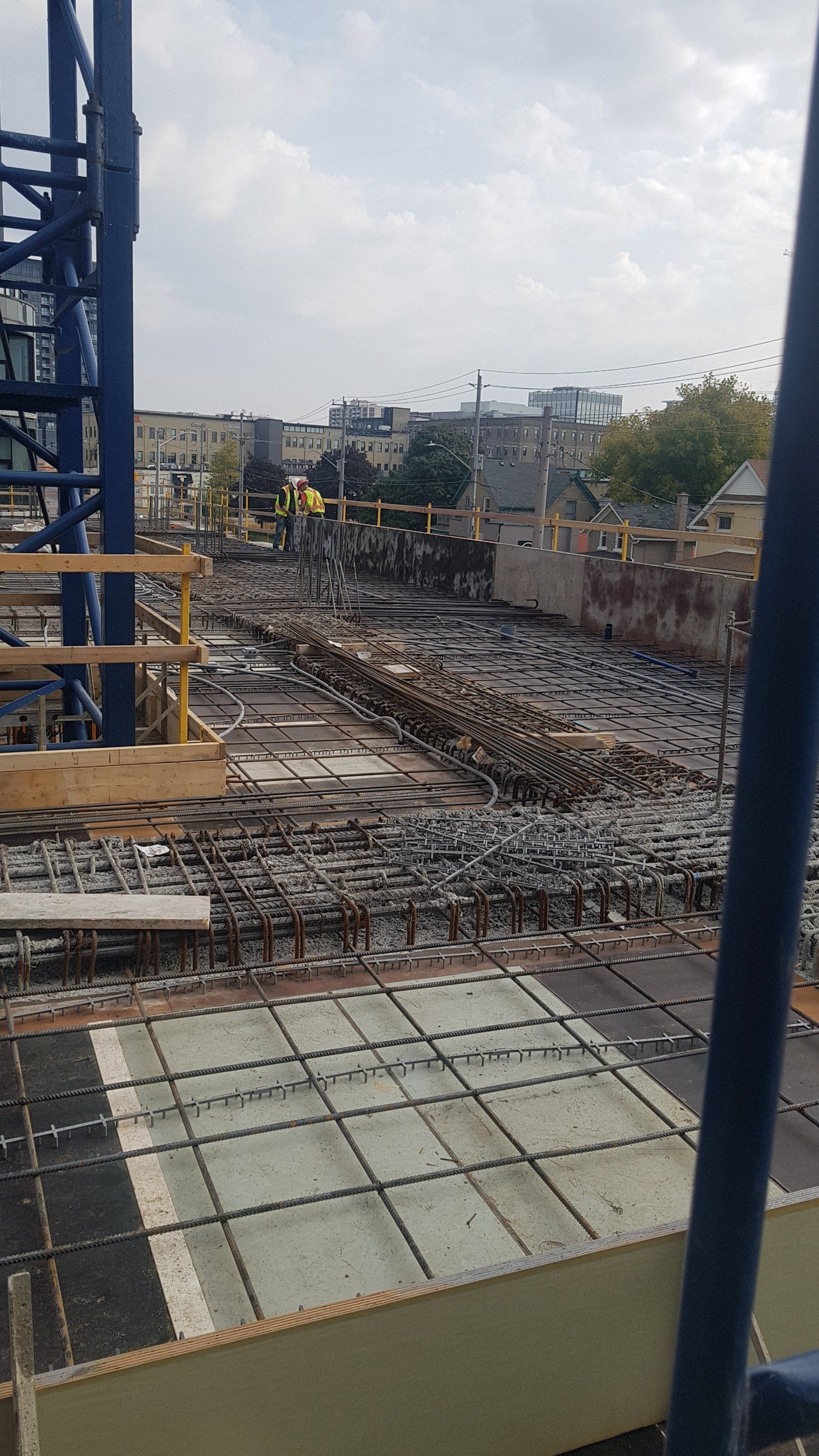A construction site with a lot of concrete and scaffolding.