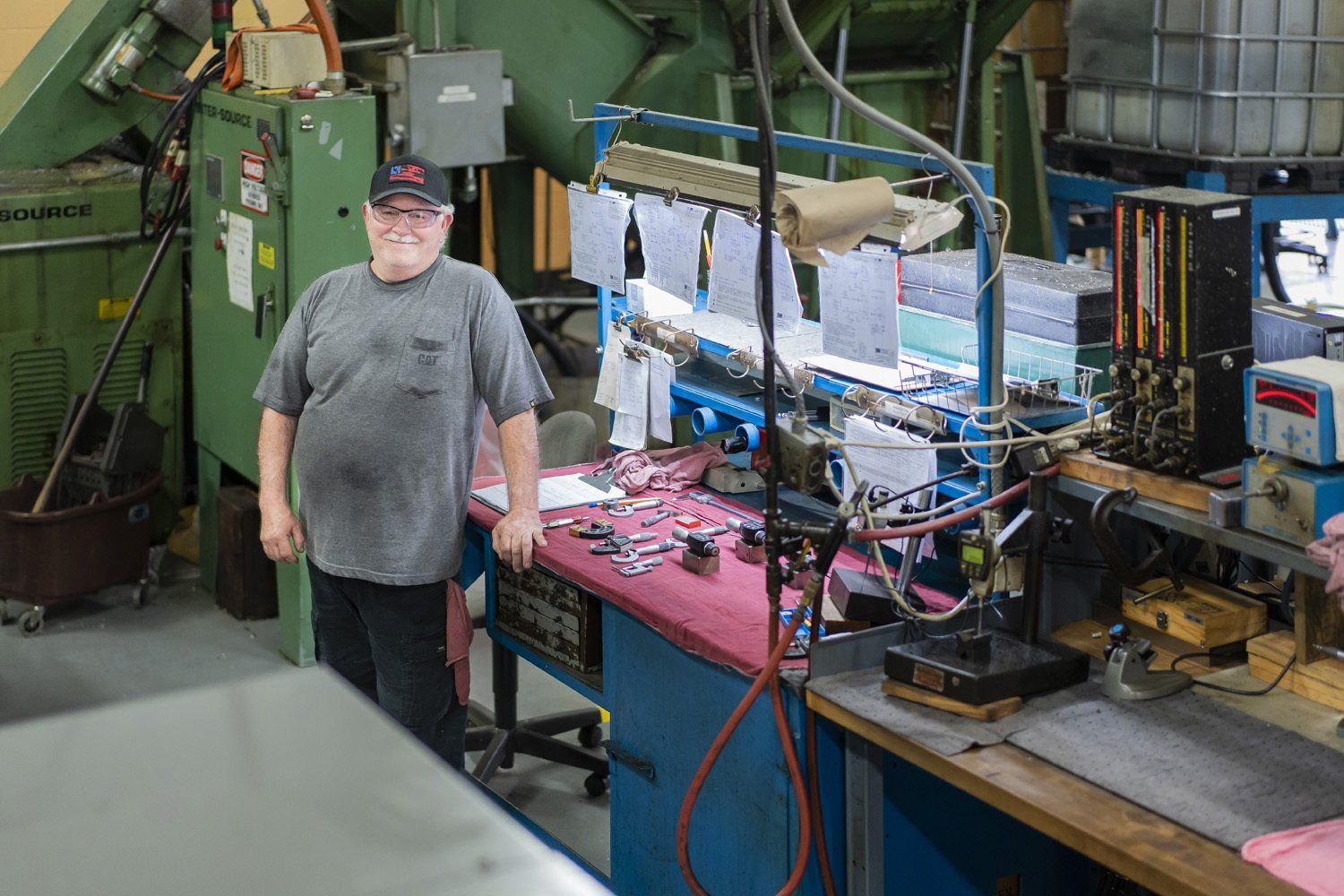 A RIMA Manufacturing Company team members posing at his desk