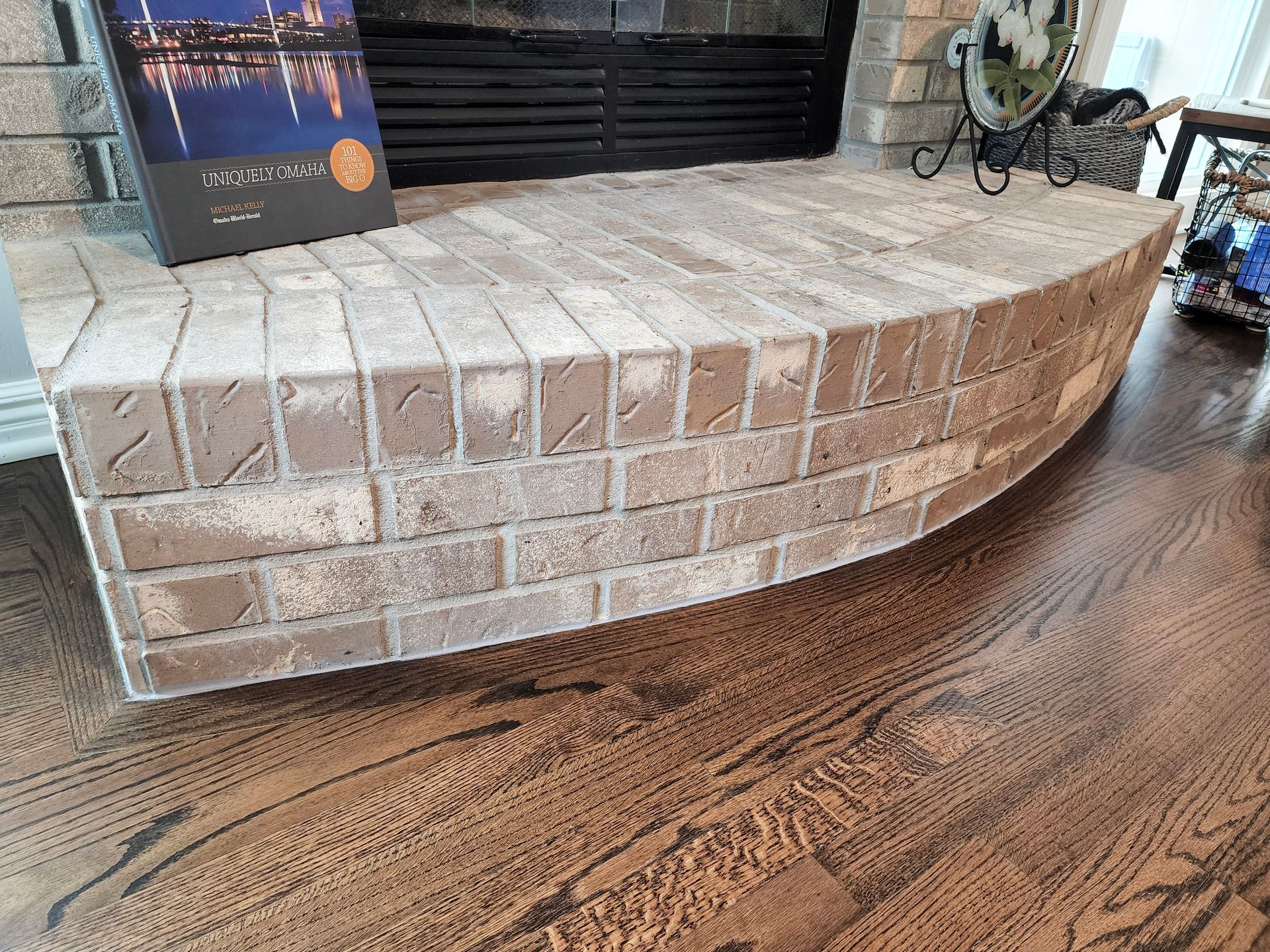 A Curved Brick Fireplace Ledge — Omaha, NE — Ohana Wood Floors Inc.