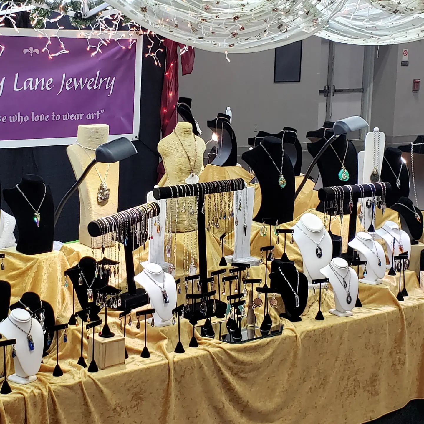 A display of jewelry with a sign that says lane jewelry