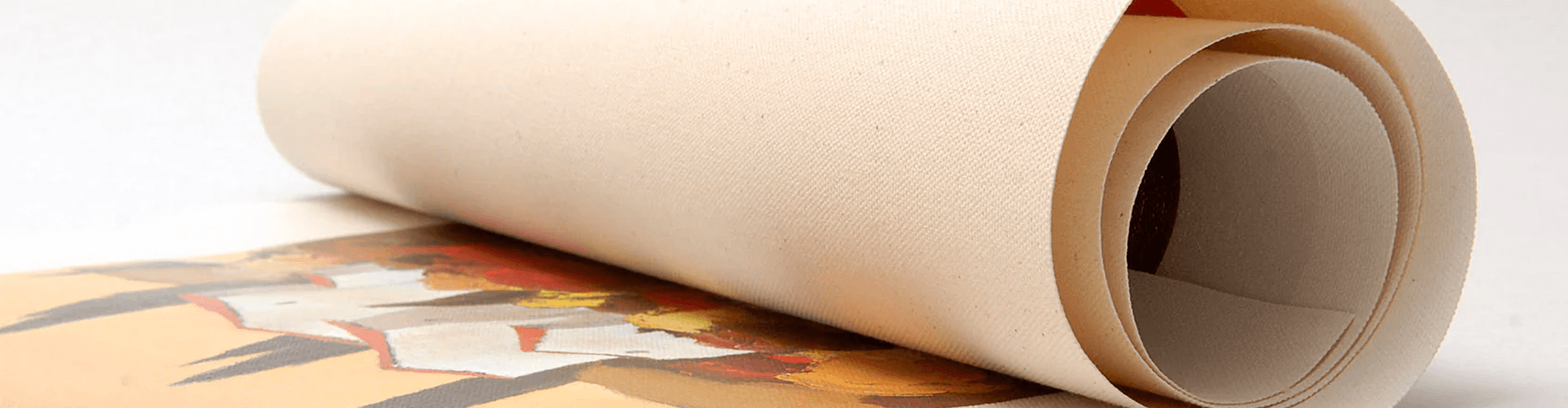 A roll of paper with a picture on it is rolled up on a table.