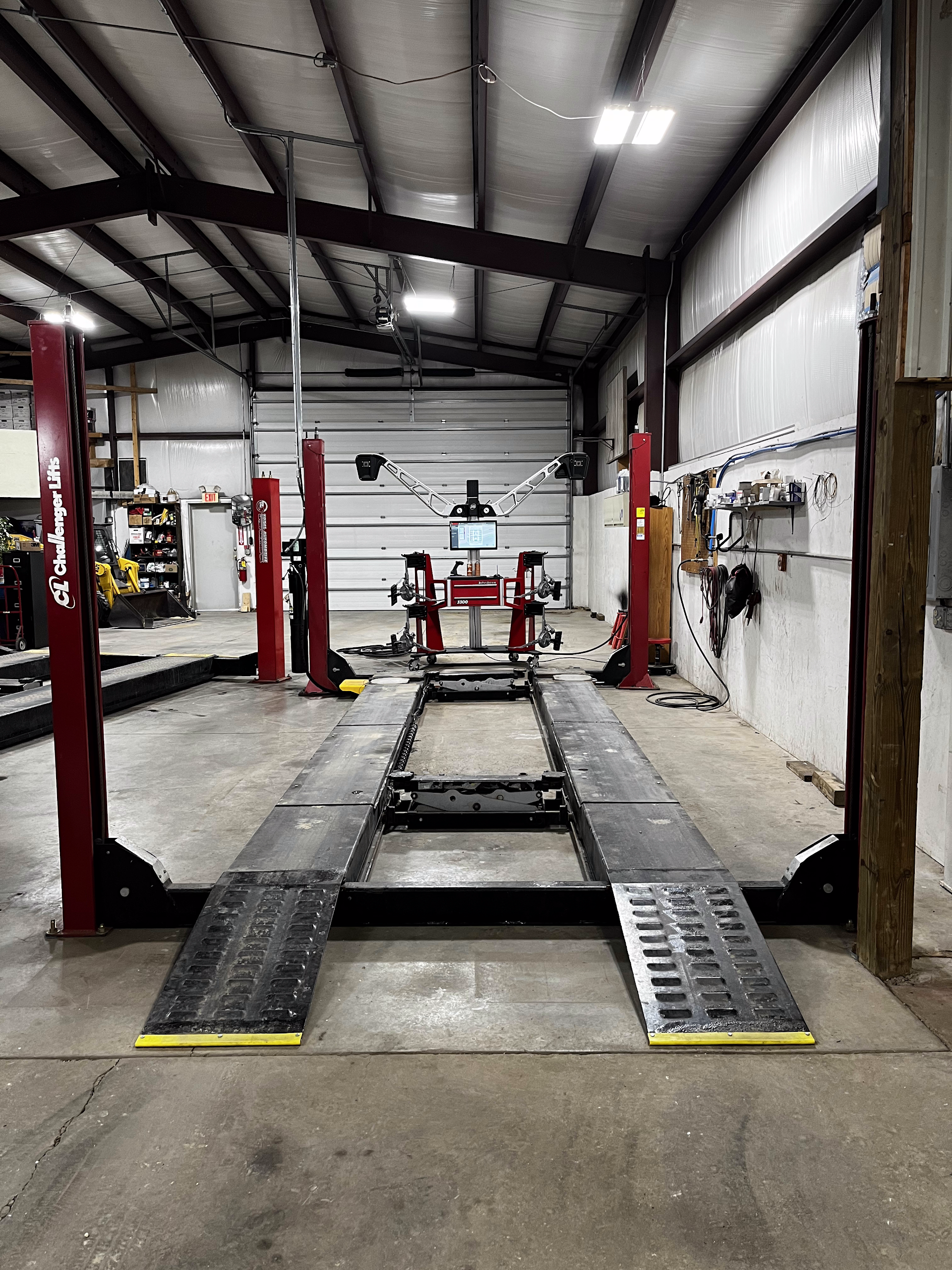 A Garage With a Motorcycle Lift in the Middle of It | Dan's Auto Centre