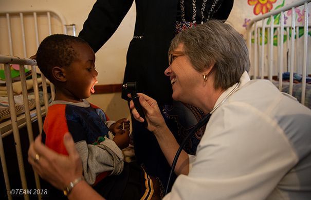 Kiersten performs a pediatric checkup at the hospital where she now serves in long-term missions