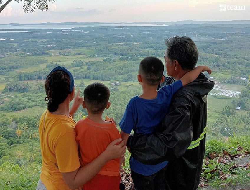 Family overlooking land.