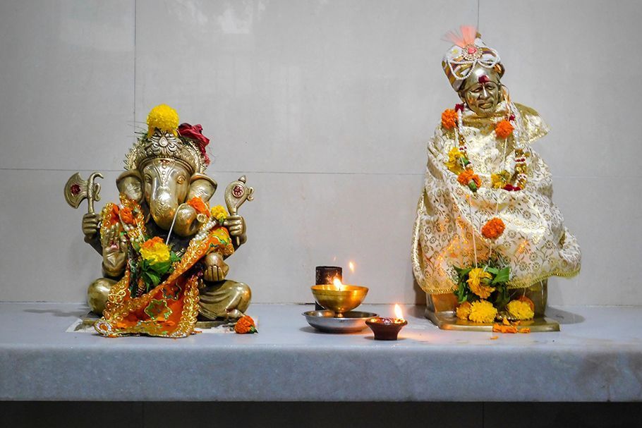 Hindu idols on a shelf.