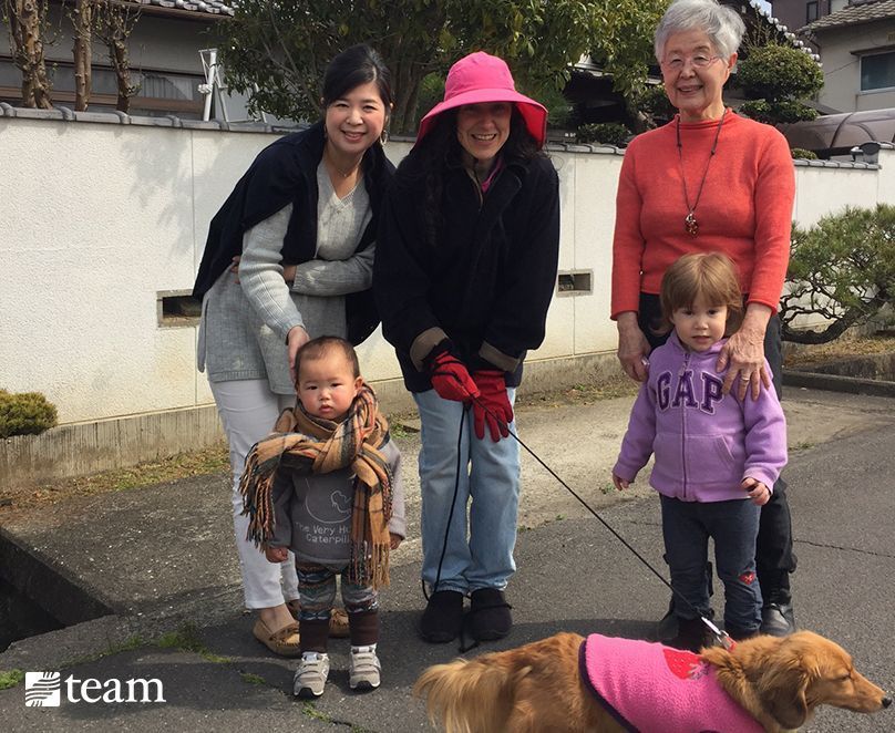 The Junker family walking their dog in their Japanese neighborhood.