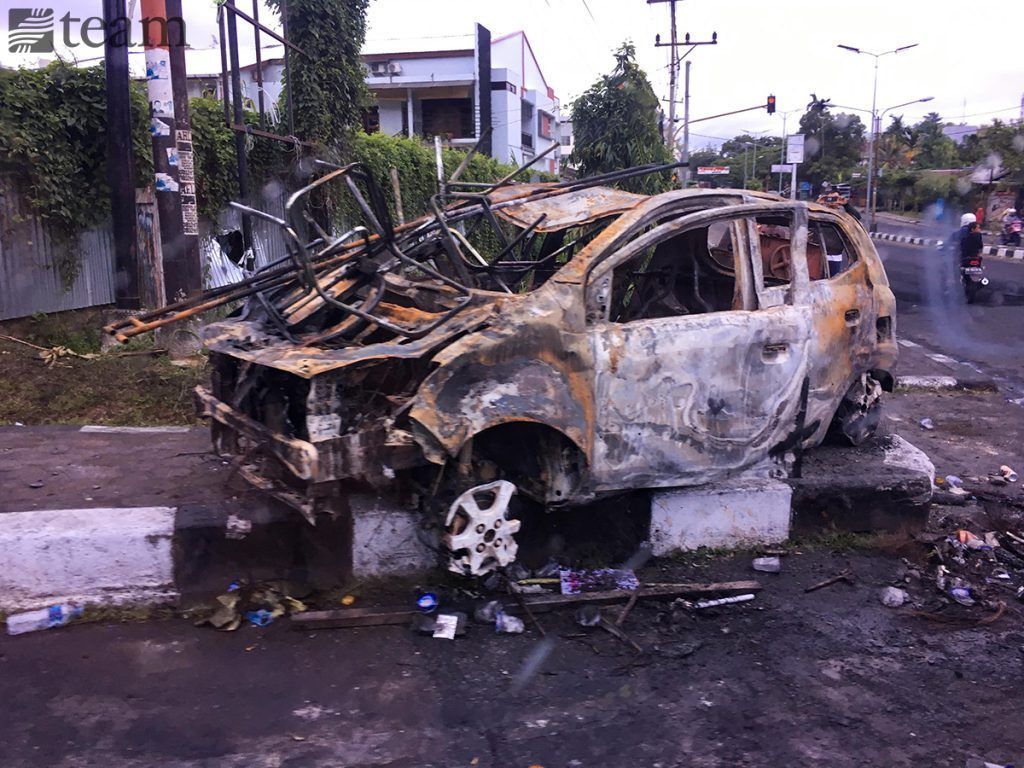 A car that was set on fire during the protests in Papua in August 2019