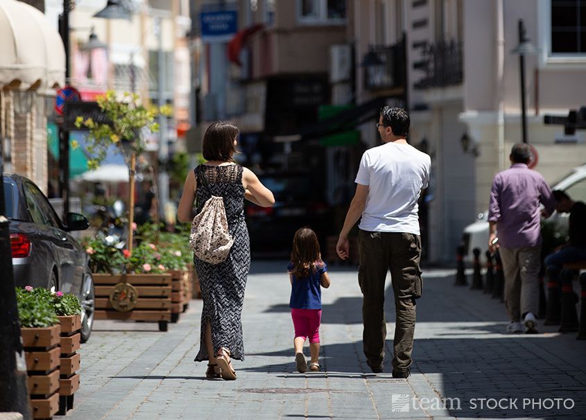 Urban ministry can be exhausting. A family in this photo takes a stroll together.