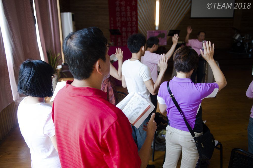 People worshiping in a church plant