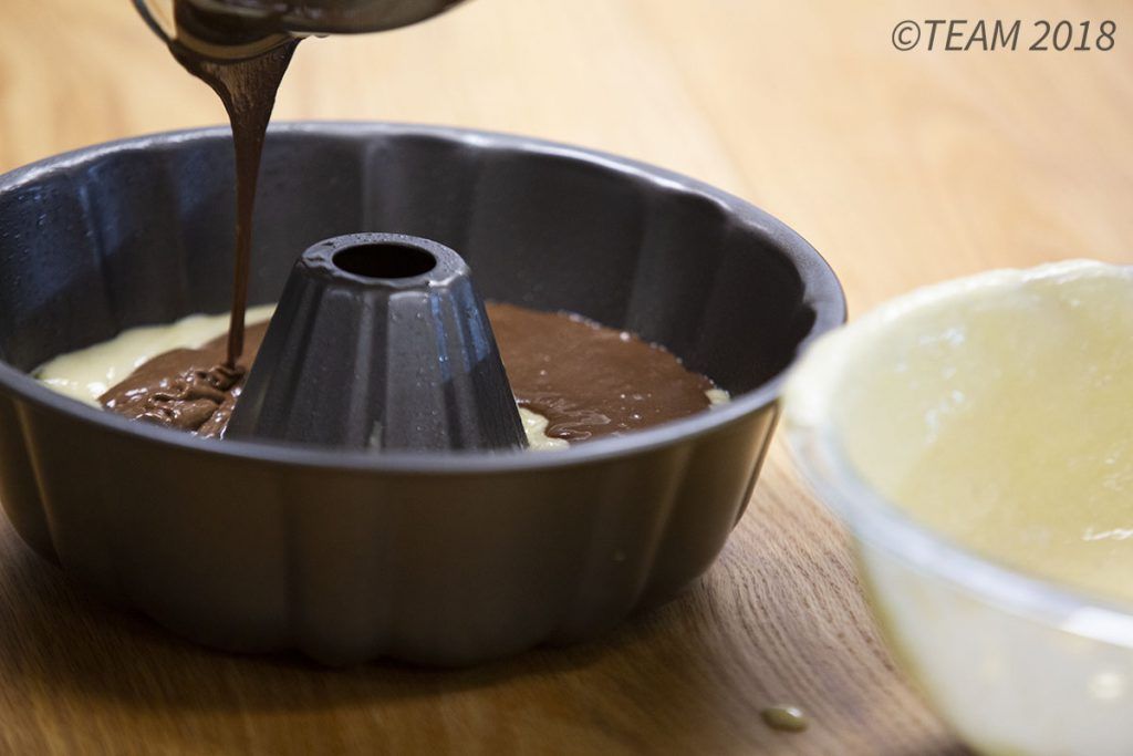 Pour the chocolate batter on top of the white batter.