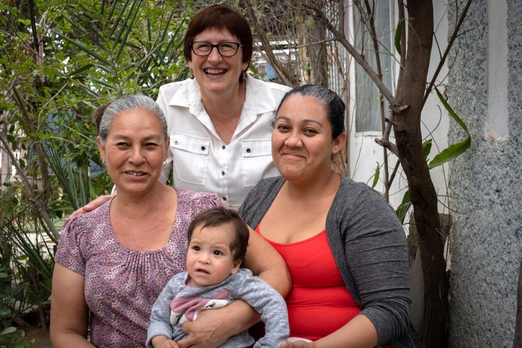 TEAM missionary Brenda Matthews poses with Vicenta, Imelda and Imelda's daughter for a portrait